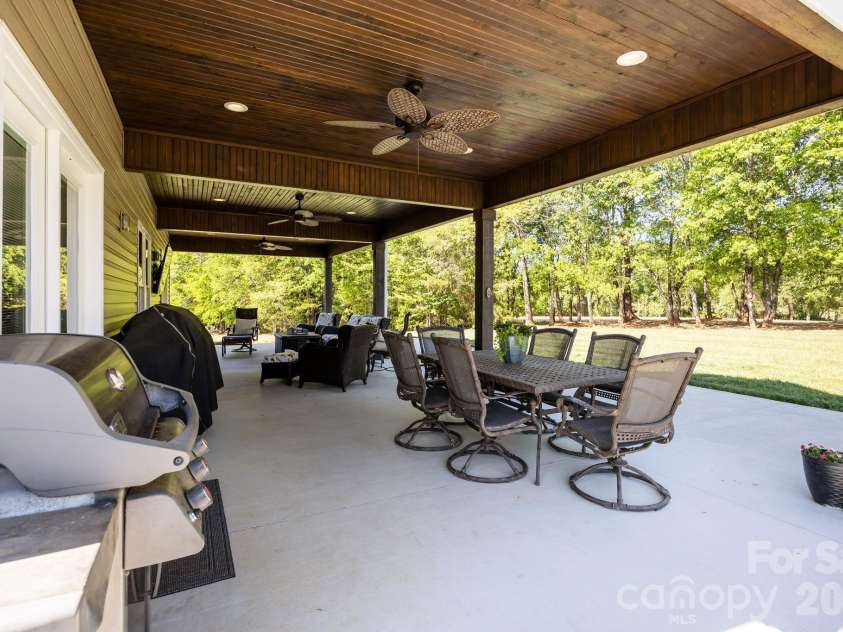 147 Haystack Lane, Olin, NC 28660.  MLS# CAR4375441, YatesRealty ID 23772. Three ceiling fans - space for dining, conversation area,  watching the game outside or whatever your imagination will want for outdoor living.