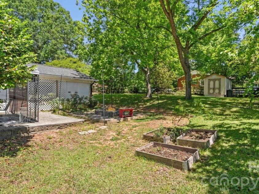 1201 Memory Lane, Monroe, NC 28112.  MLS# CAR4383168, YatesRealty ID 23775. Back Yard with Patio and Gardening