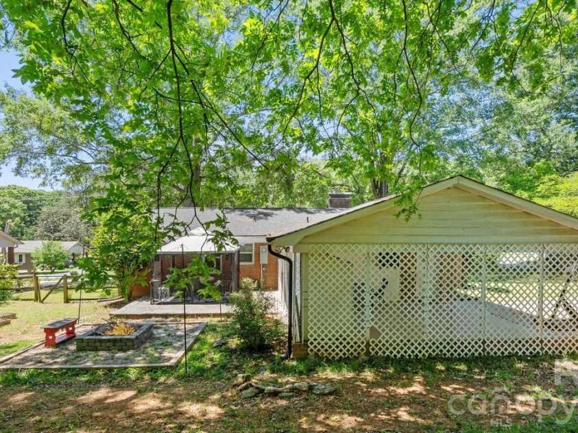 1201 Memory Lane, Monroe, NC 28112.  MLS# CAR4383168, YatesRealty ID 23775. Back Yard with Virtual Fire in Fire Pit