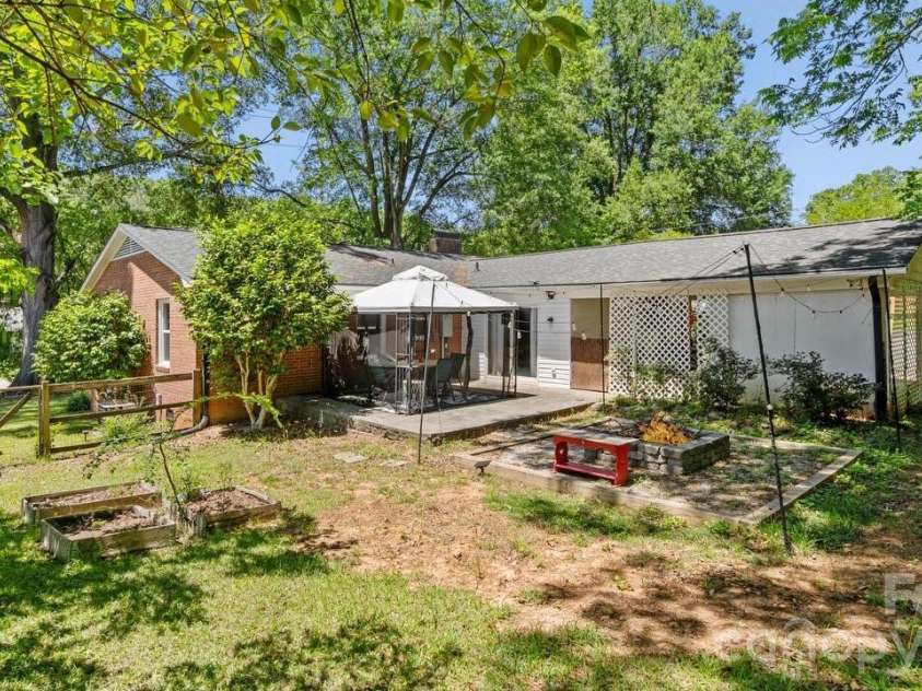 1201 Memory Lane, Monroe, NC 28112.  MLS# CAR4383168, YatesRealty ID 23775. View of House from Back Yard with Virtual Fire