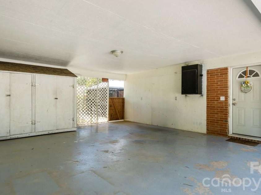 1201 Memory Lane, Monroe, NC 28112.  MLS# CAR4420714, YatesRealty ID 23775. Carport
