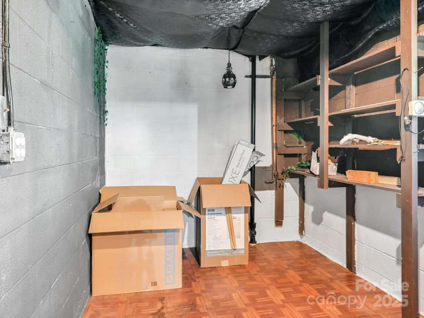 8 Mayfair Drive, Candler, NC 28715.  MLS# CAR4273573, YatesRealty ID 23775. Basement storage