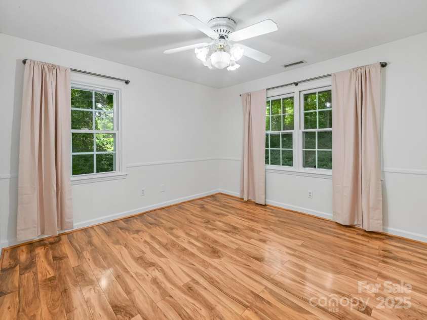 8 Mayfair Drive, Candler, NC 28715.  MLS# CAR4273573, YatesRealty ID 23775. Primary bedroom