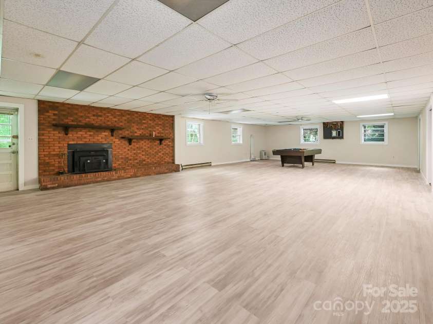 8 Mayfair Drive, Candler, NC 28715.  MLS# CAR4273573, YatesRealty ID 23775. Rec room in basement