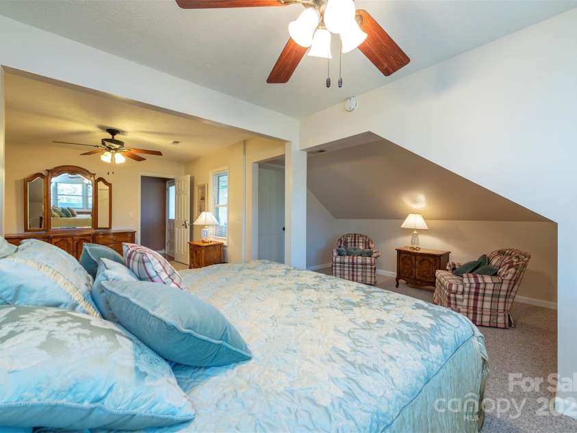 1740 Haywood Road, Hendersonville, NC 28791.  MLS# CAR4226897, YatesRealty ID 2378. 5th ensuite bedroom with access to two covered porches