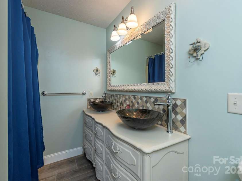 1740 Haywood Road, Hendersonville, NC 28791.  MLS# CAR4226897, YatesRealty ID 2378. Ensuite bathroom attached to sixth bedroom