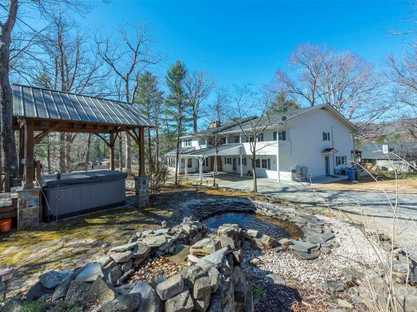 1740 Haywood Road, Hendersonville, NC 28791.  MLS# CAR4226897, YatesRealty ID 2378. Hot tub requires a new part to be fully functional. Or converted into an outdoor kitchen, creating the perfect space for al fresco dining and entertaining.