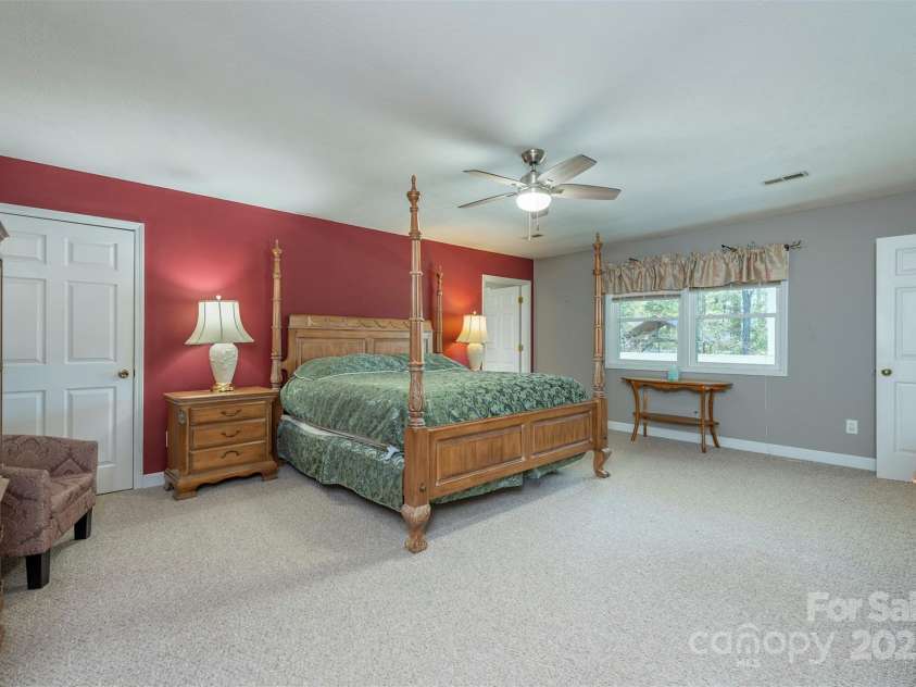 1740 Haywood Road, Hendersonville, NC 28791.  MLS# CAR4226897, YatesRealty ID 2378. Primary bedroom with an ensuite bathroom, offering luxury and privacy—perfect for maximizing rental income in both short-term and long-term rentals.
