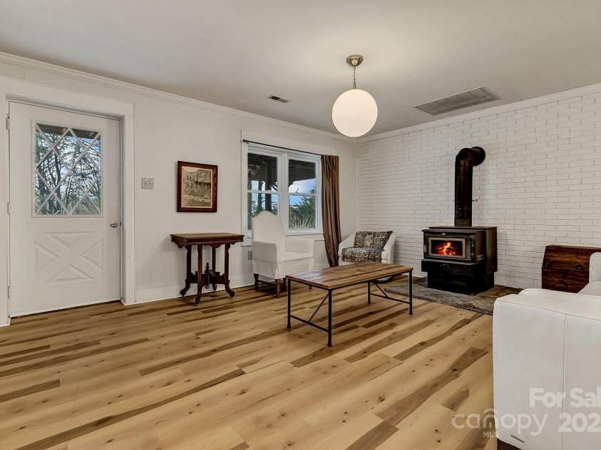 570 Brandon Road, Black Mountain, NC 28711.  MLS# CAR4241895, YatesRealty ID 238. Lower Level Living Room