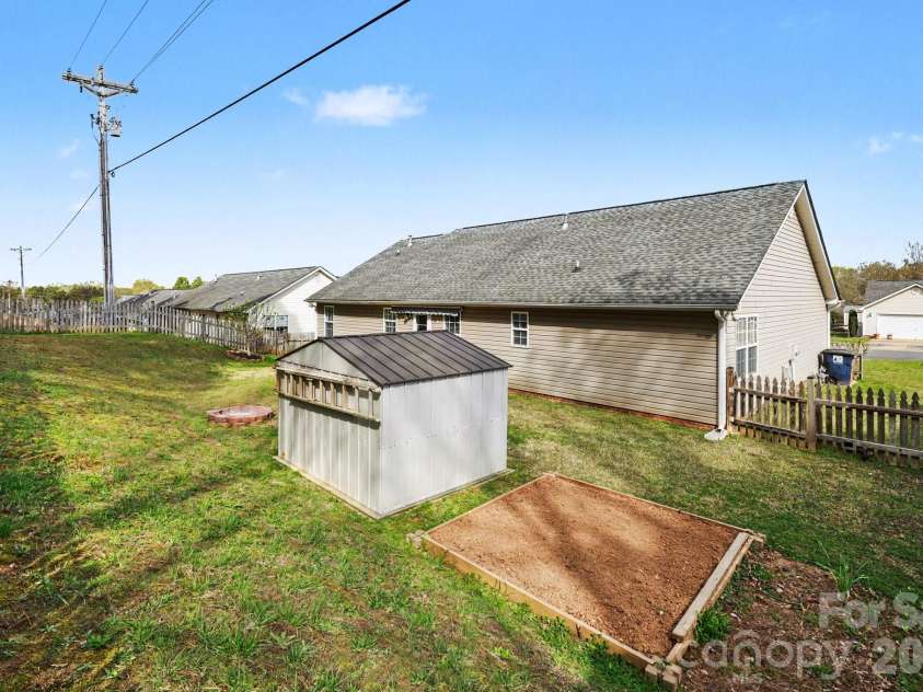 1117 Landen Chase Drive, Monroe, NC 28110.  MLS# CAR4360372, YatesRealty ID 23802. Backyard with shed