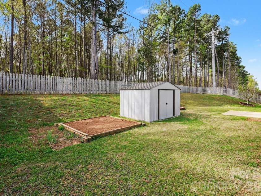 1117 Landen Chase Drive, Monroe, NC 28110.  MLS# CAR4360372, YatesRealty ID 23802. Backyard with Shed