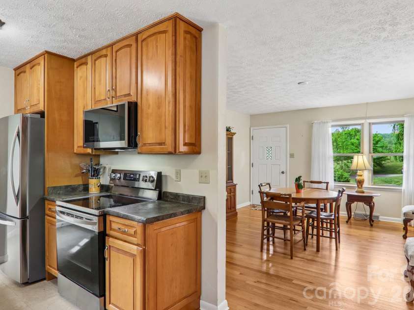 401 Lower Grassy Branch Road, Asheville, NC 28805.  MLS# CAR4376459, YatesRealty ID 23804. Kitchen to dining