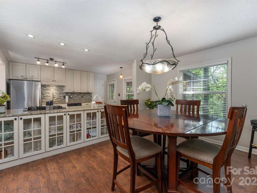 26 Foxberry Drive, Arden, NC 28704.  MLS# CAR4325945, YatesRealty ID 2381. Dining Room open to kitchen. 
