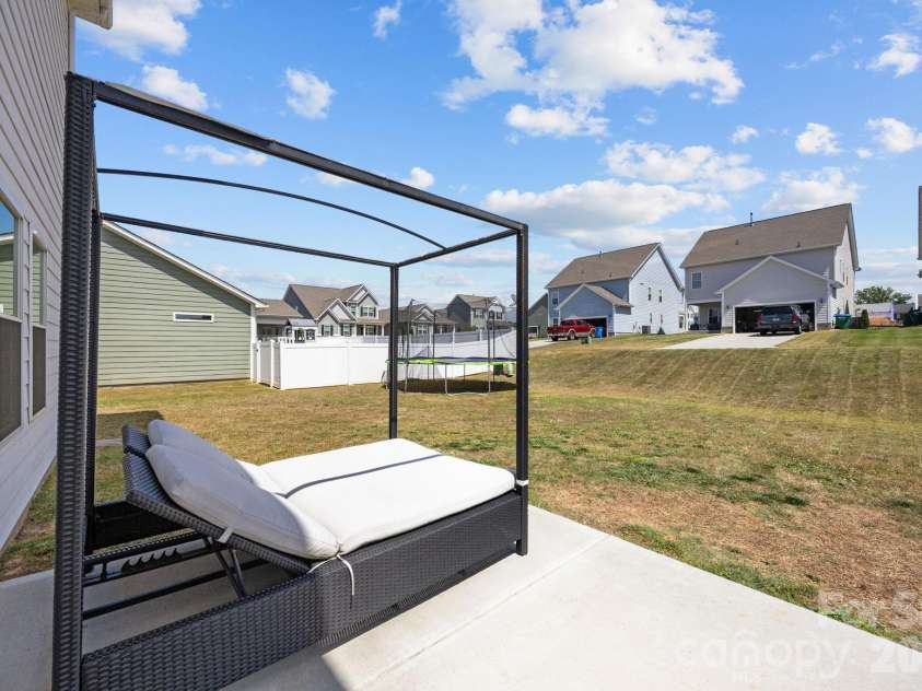 526 Ardsley Drive, Locust, NC 28097.  MLS# CAR4377039, YatesRealty ID 23814. 10'x12' concrete patio at 526 Ardsley Dr, Locust