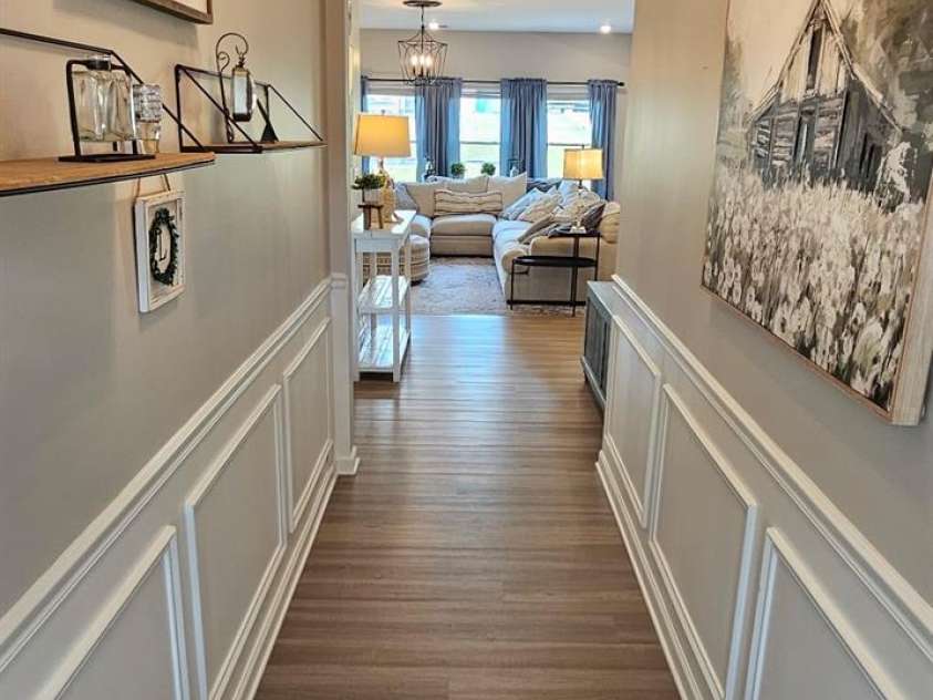 526 Ardsley Drive, Locust, NC 28097.  MLS# CAR4377039, YatesRealty ID 23814. Chair rail and shadow boxing line the hallway of 526 Ardsley Dr, Locust