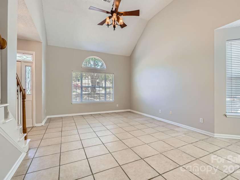 8909 Elkins Park Drive, Matthews, NC 28105.  MLS# CAR4275942, YatesRealty ID 23818. Cathedral ceilings in the formal living area