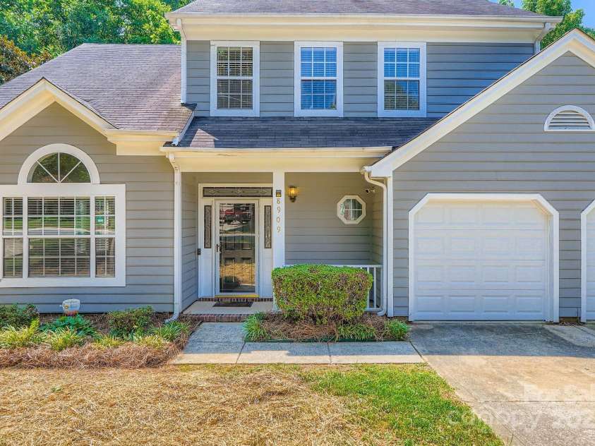 8909 Elkins Park Drive, Matthews, NC 28105.  MLS# CAR4275942, YatesRealty ID 23818. Covered front porch