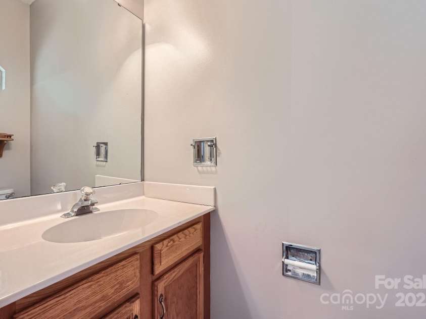 8909 Elkins Park Drive, Matthews, NC 28105.  MLS# CAR4275942, YatesRealty ID 23818. Main level powder room