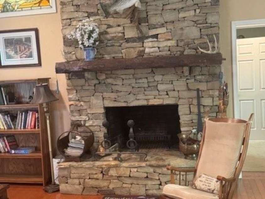 240 Goshen Terrace, Wilkesboro, NC 28697.  MLS# CAR4262846, YatesRealty ID 23821. Rock fireplace - door to primary bedroom on the right