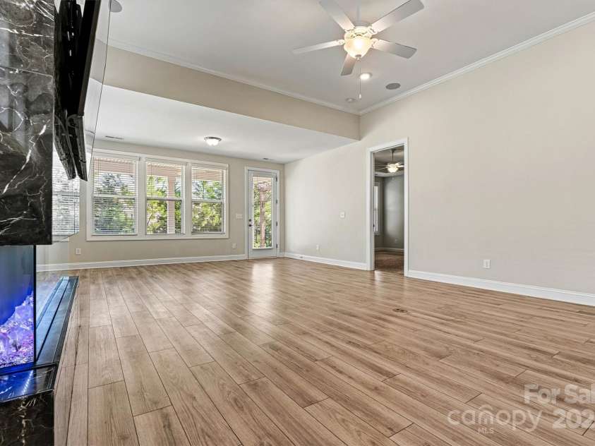 7315 Surprise Court, Charlotte, NC 28215.  MLS# CAR4276101, YatesRealty ID 23823. Contemporary electric fireplace doubles as a design feature and mood-setter with its customizable flame display.