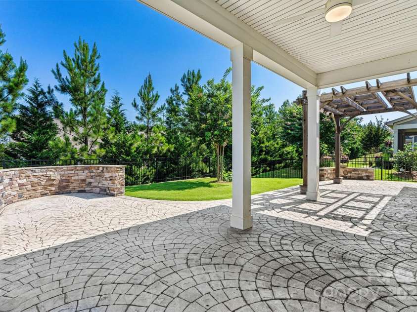 7315 Surprise Court, Charlotte, NC 28215.  MLS# CAR4276101, YatesRealty ID 23823. Covered porch, pergola, and stamped concrete patio—so many spots to relax or entertain.