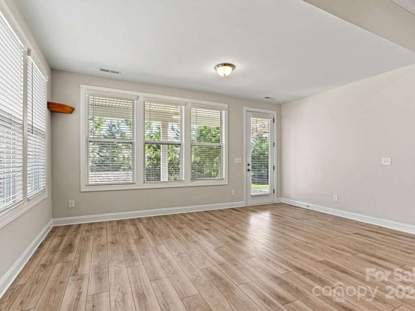 7315 Surprise Court, Charlotte, NC 28215.  MLS# CAR4276101, YatesRealty ID 23823. Extended living space flows seamlessly to a stunning outdoor retreat.