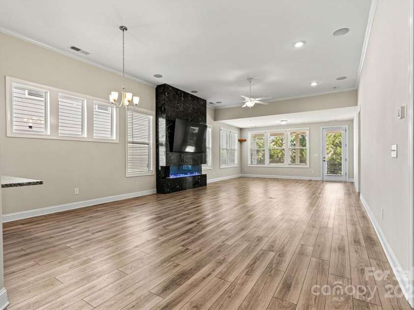 7315 Surprise Court, Charlotte, NC 28215.  MLS# CAR4276101, YatesRealty ID 23823. Fresh neutral paint, rich low maintenance EVP floors and custom 2