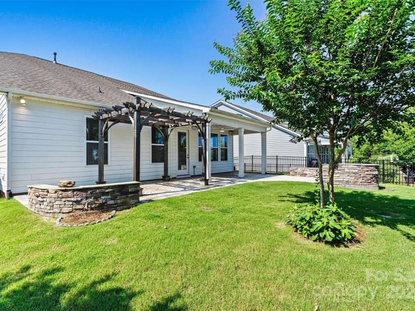 7315 Surprise Court, Charlotte, NC 28215.  MLS# CAR4276101, YatesRealty ID 23823. Fully fenced rear yard with two gates and a retaining wall—private, secure, and absolutely gorgeous!