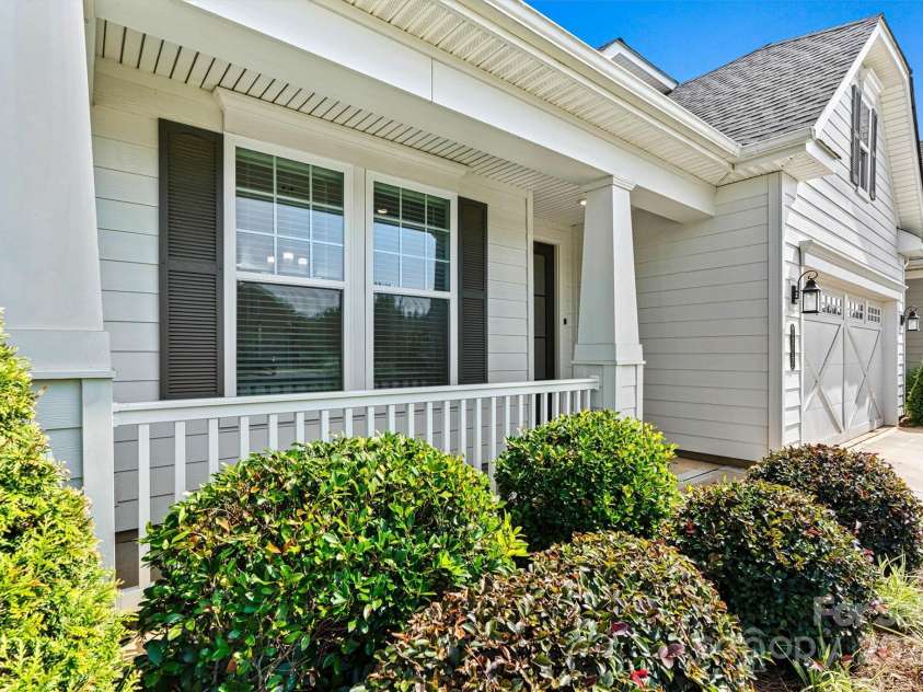 7315 Surprise Court, Charlotte, NC 28215.  MLS# CAR4276101, YatesRealty ID 23823. The warm and welcoming covered front porch is ideal for coffee, conversation, and friendly hellos.