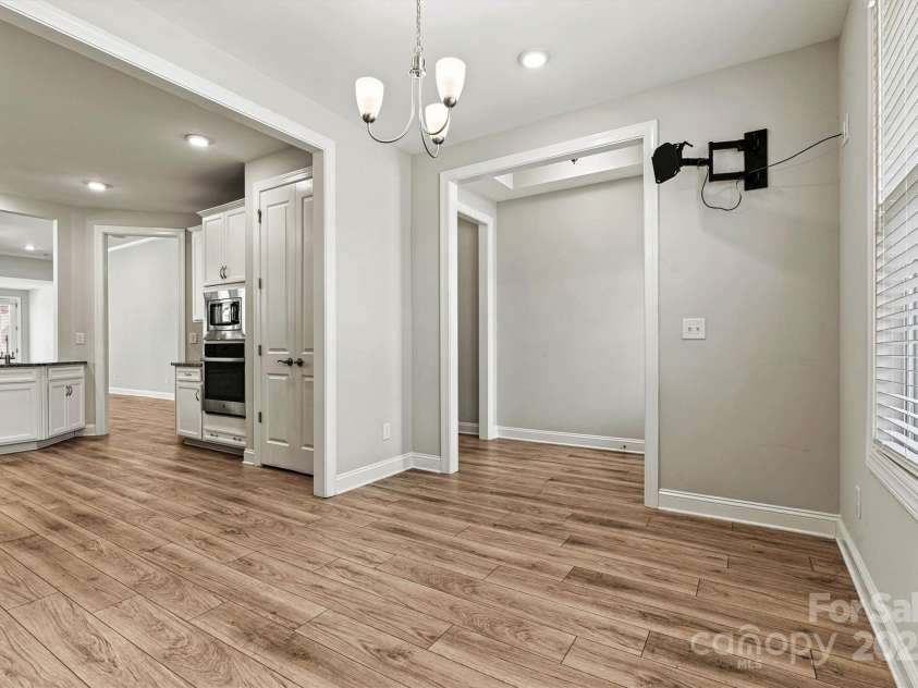 7315 Surprise Court, Charlotte, NC 28215.  MLS# CAR4276101, YatesRealty ID 23823. TV mount in Café space conveys—ready for your favorite shows or video calls.