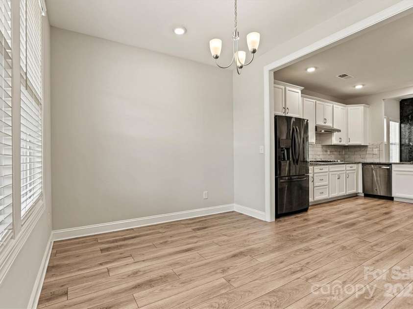 7315 Surprise Court, Charlotte, NC 28215.  MLS# CAR4276101, YatesRealty ID 23823. Versatile front Café—ideal for a home office, dining nook, or cozy game nights with friends and family.