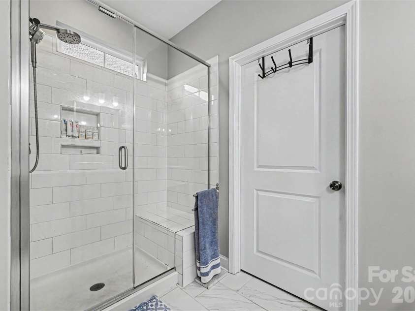 122 Boatwright Lane, Mooresville, NC 28117.  MLS# CAR4377794, YatesRealty ID 23826. Easy step standning shower