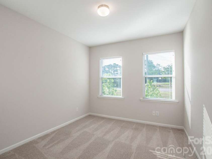 1270 Brawley School Road, Mooresville, NC 28117.  MLS# CAR4373576, YatesRealty ID 23829. Front Bedroom 2