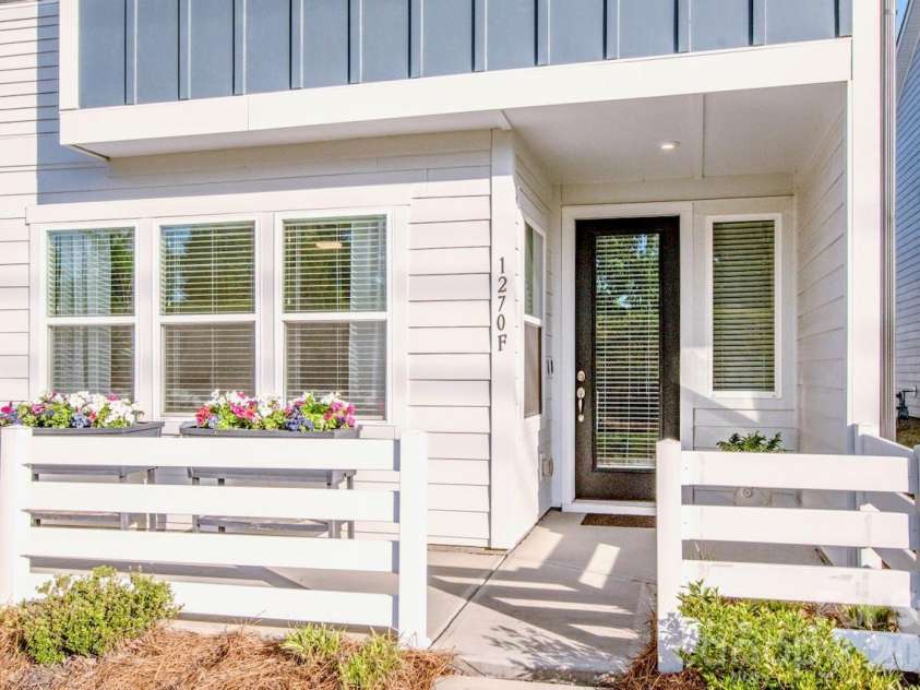1270 Brawley School Road, Mooresville, NC 28117.  MLS# CAR4373576, YatesRealty ID 23829. Inviting covered front entry with planters