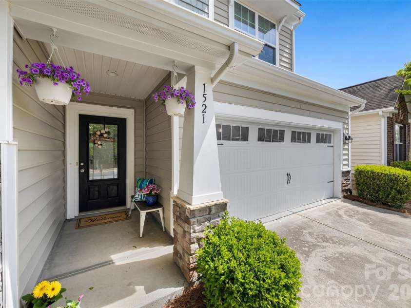 1521 Deer Meadows Drive, Waxhaw, NC 28173.  MLS# CAR4367982, YatesRealty ID 23831. Inviting covered front porch