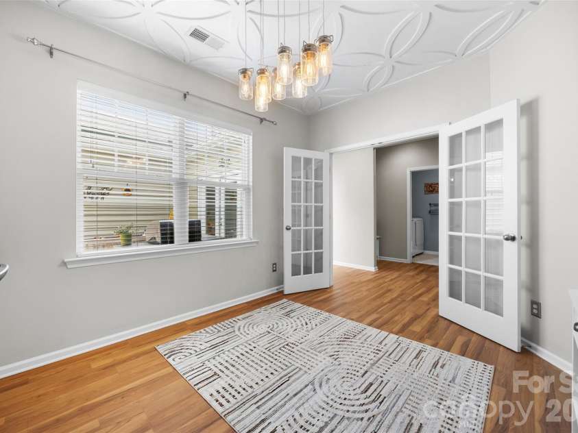 1521 Deer Meadows Drive, Waxhaw, NC 28173.  MLS# CAR4367982, YatesRealty ID 23831. Office on main level with built-ins, French doors and custom millwork on ceiling