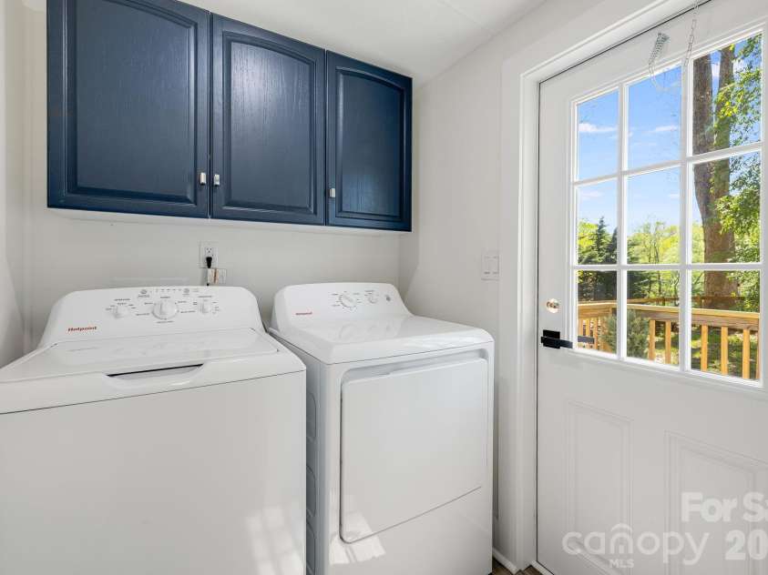 4 Woodscape Drive, Mills River, NC 28759.  MLS# CAR4372590, YatesRealty ID 23832. Laundry room with access to back deck