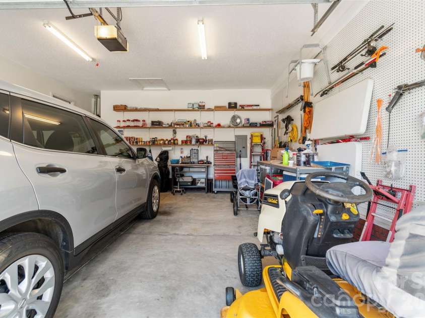 202 Big Dipper Court, Wingate, NC 28174.  MLS# CAR4382477, YatesRealty ID 23833. Garage w/built-in shelves