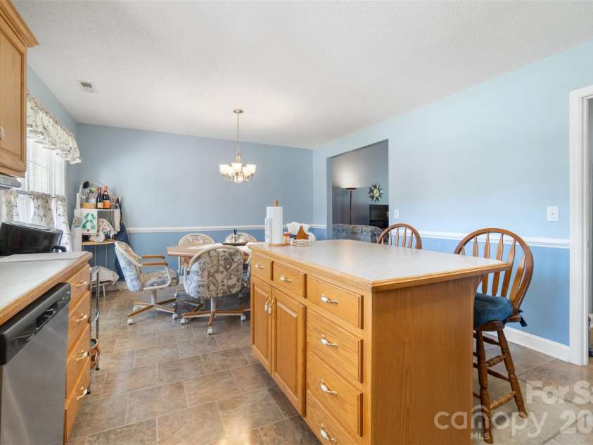 202 Big Dipper Court, Wingate, NC 28174.  MLS# CAR4382477, YatesRealty ID 23833. Kitchen/breakfast area w/eat-in island