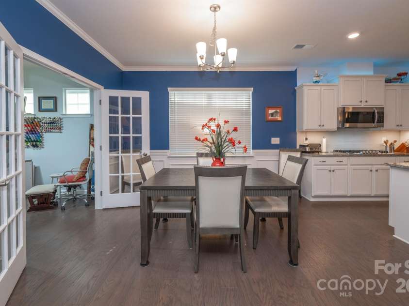 548 Cellini Place, Mount Holly, NC 28120.  MLS# CAR4275205, YatesRealty ID 23836. Dining area to bonus sunroom