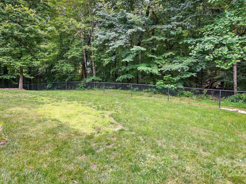 2745 Stockwood Drive, Gastonia, NC 28056.  MLS# CAR4253983, YatesRealty ID 23845. So much fenced yard