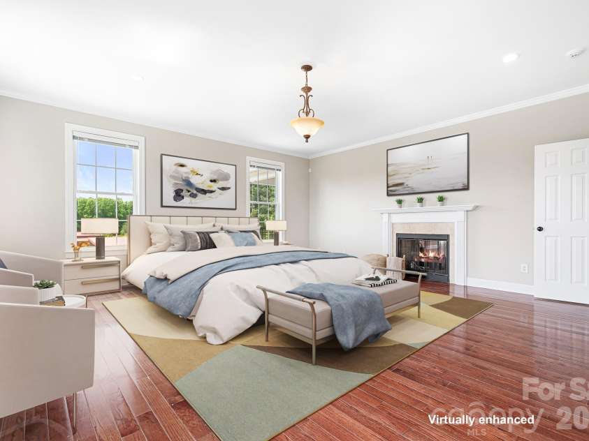 3987 NC 27 Highway, Lincolnton, NC 28092.  MLS# CAR4381735, YatesRealty ID 23846. Virtually Staged Primary Bedroom with Gas Fireplace is Spacious & Filled with Natural Light
