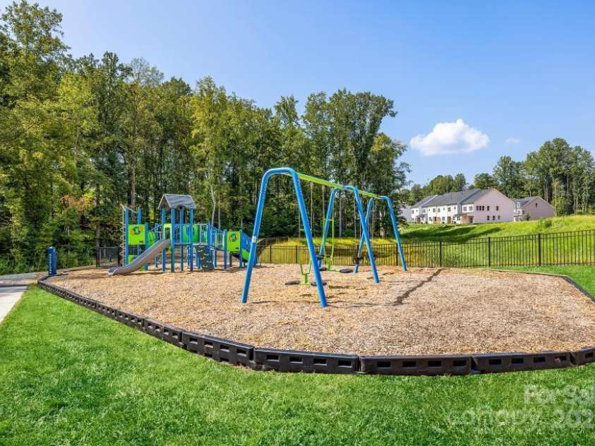 6022 Moonglade Lane, Charlotte, NC 28269.  MLS# CAR4315621, YatesRealty ID 2385. Enjoy time outdoors with a thoughtfully designed playground for all ages.