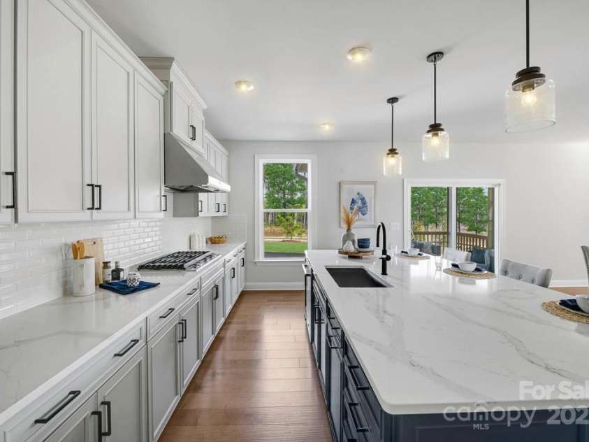 6022 Moonglade Lane, Charlotte, NC 28269.  MLS# CAR4315621, YatesRealty ID 2385. Photos are of a previously built Nayan Model home and are for illustrative purposes only. Design selections, finishes, and features may vary in the actual home.