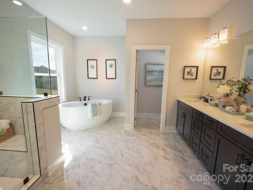 6022 Moonglade Lane, Charlotte, NC 28269.  MLS# CAR4315621, YatesRealty ID 2385. Photos are of a previously built Nayan Model home and are for illustrative purposes only. Design selections, finishes, and features may vary in the actual home.