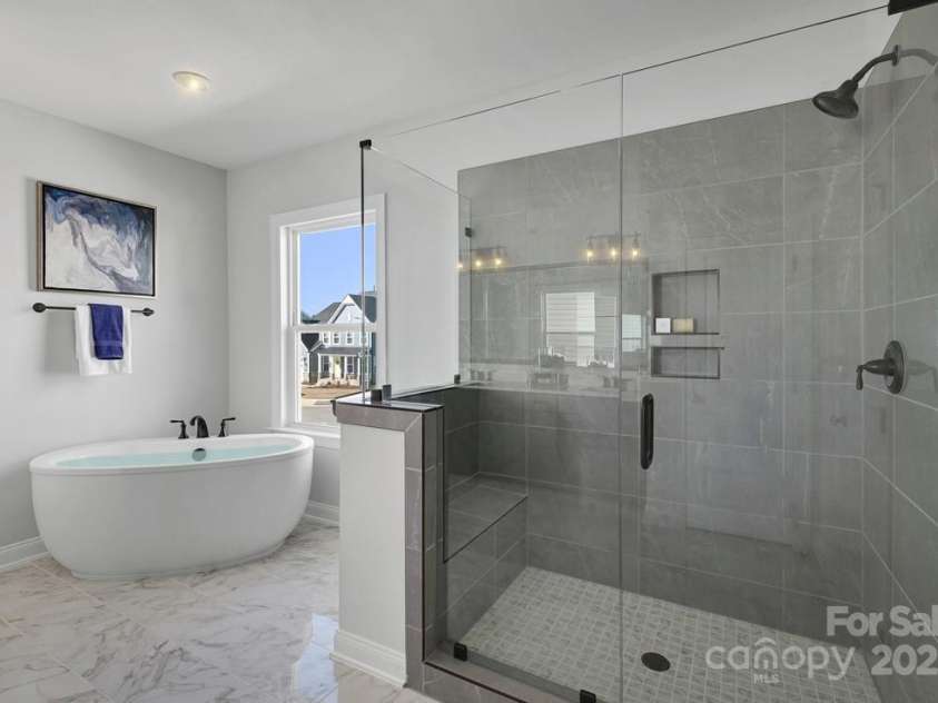 6022 Moonglade Lane, Charlotte, NC 28269.  MLS# CAR4315621, YatesRealty ID 2385. Photos are of a previously built Nayan Model home and are for illustrative purposes only. Design selections, finishes, and features may vary in the actual home.