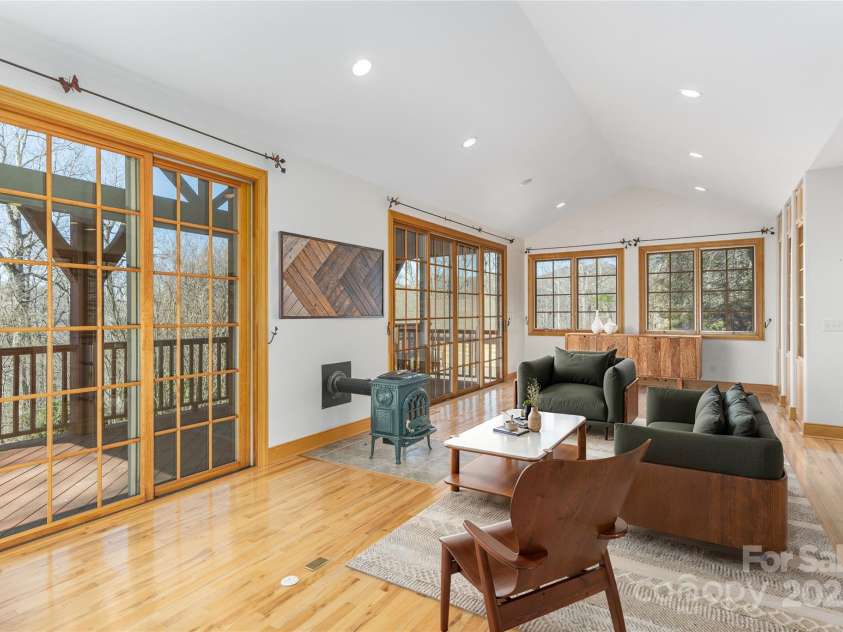 98 Flat Creek Road, Fairview, NC 28730.  MLS# CAR4185540, YatesRealty ID 2385. Virtually Furnished Guest Living Room