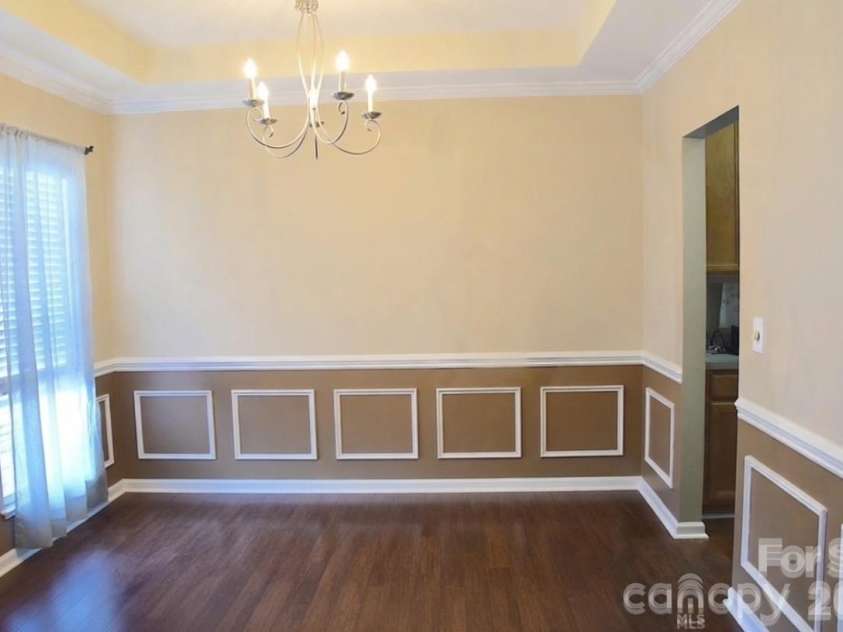 2007 Streamlet Way, Monroe, NC 28110.  MLS# CAR4376790, YatesRealty ID 23855. AI Staged Formal Dining Room