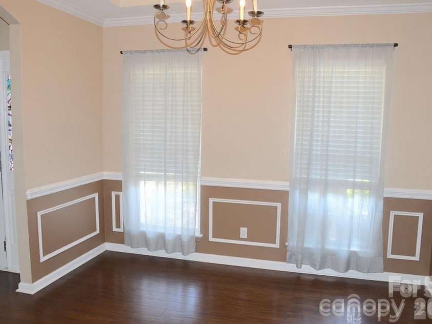 2007 Streamlet Way, Monroe, NC 28110.  MLS# CAR4376790, YatesRealty ID 23855. AI Staged Formal Dining Room