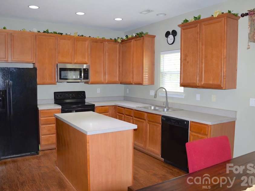 2007 Streamlet Way, Monroe, NC 28110.  MLS# CAR4376790, YatesRealty ID 23855. AI Staged Kitchen